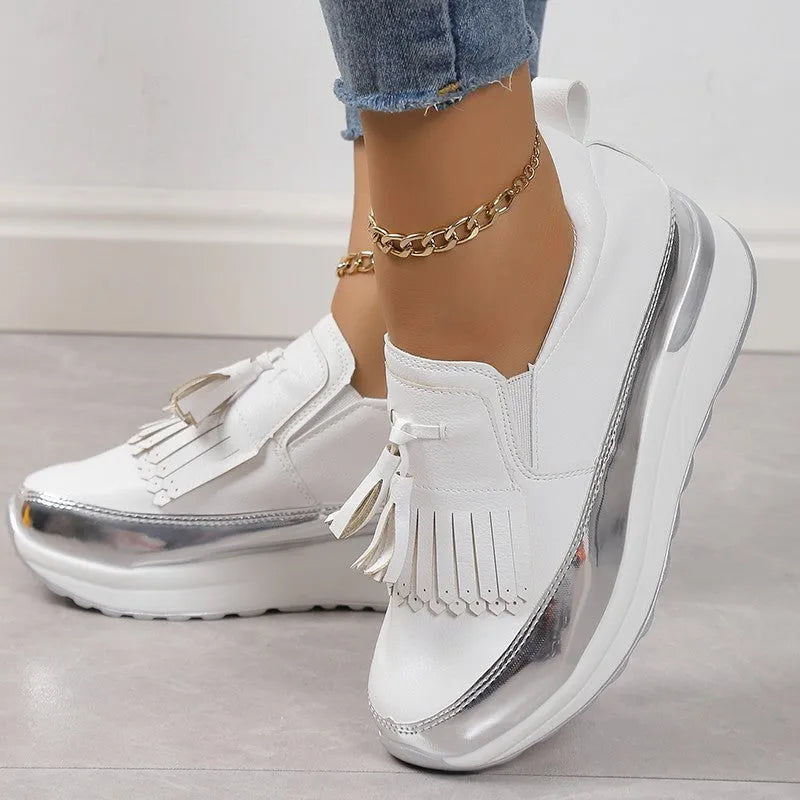 Women's black casual platform shoes with tassel detail and wedge heel