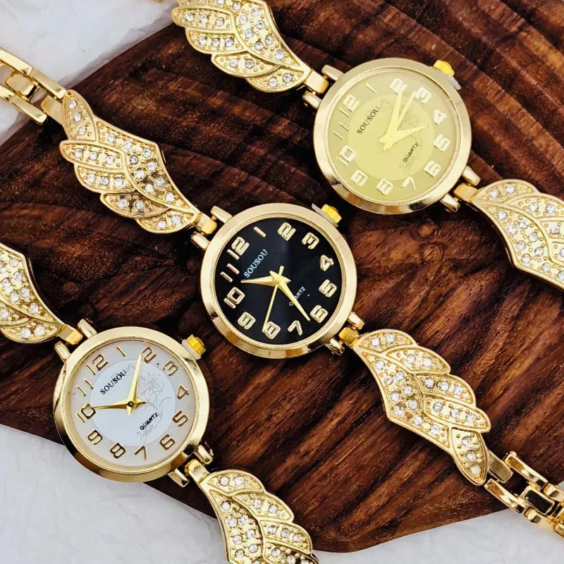 Stainless steel women's watch with round dial and Vachette clasp in gold, black and gold, or gold and white.