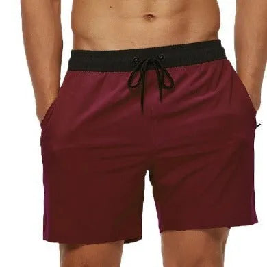 Men's blue stitching waist athletic shorts with a drawstring and zippered side pocket.
