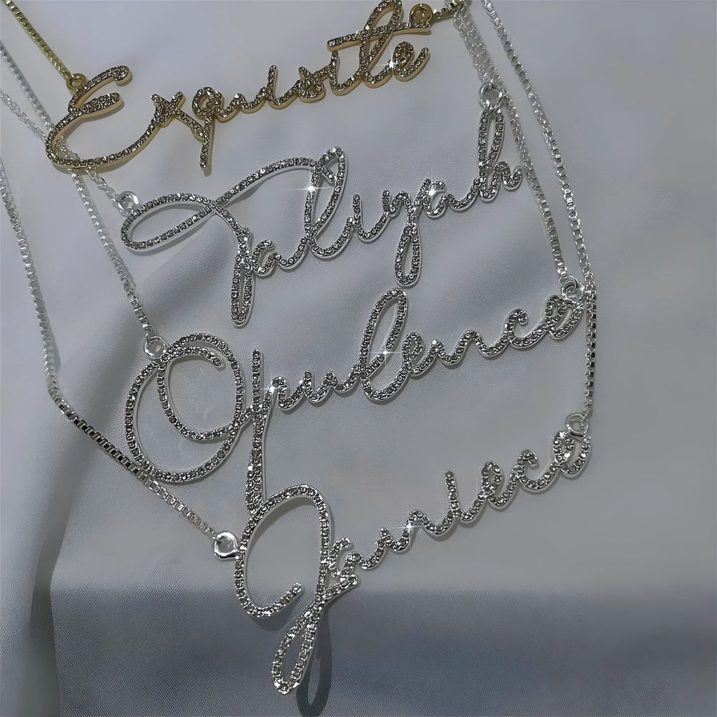 Stainless steel name necklace with diamond-studded letters in silver, available in multiple lengths.