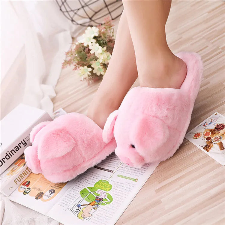 Pink pig-shaped floor slippers made of short plush material.