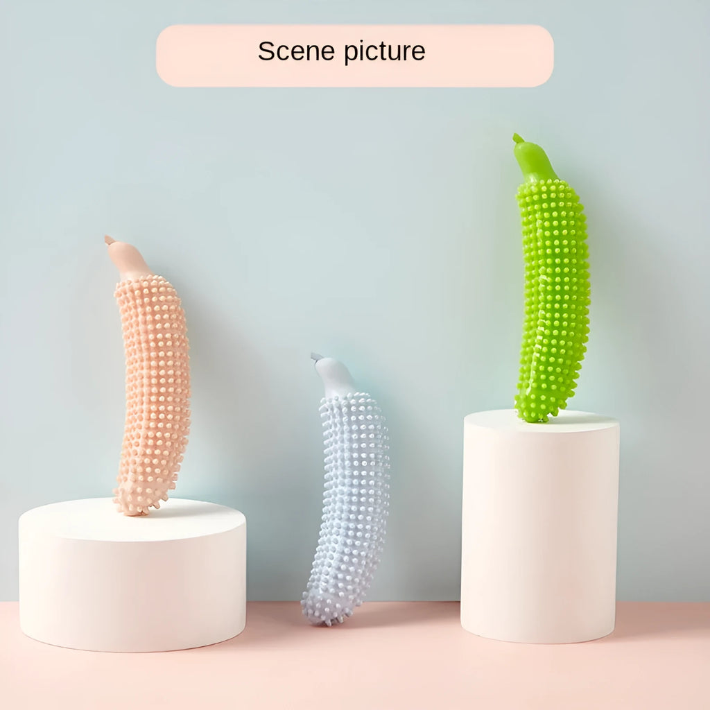 Green cucumber-shaped dog chew toy for teething and interactive play.