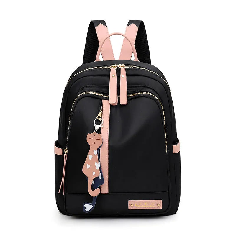Black nylon casual backpack with external pockets, shown with adjustable straps and a soft handle.