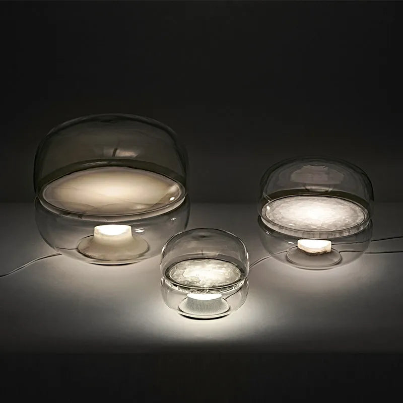 Nordic modern creative table lamp with warm light on a desk