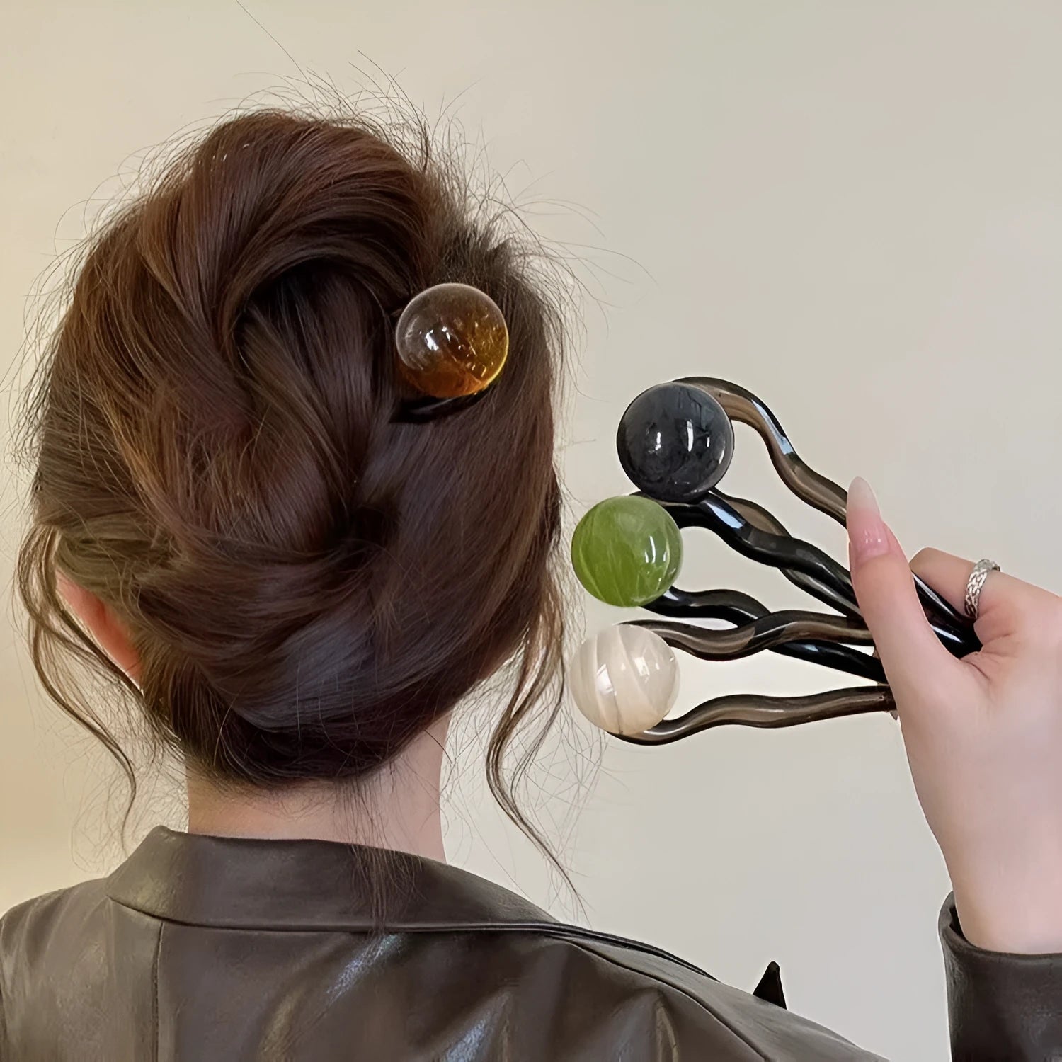 U-shaped hair barrettes with ball decoration in beige, caramel, dark gray and green colour options