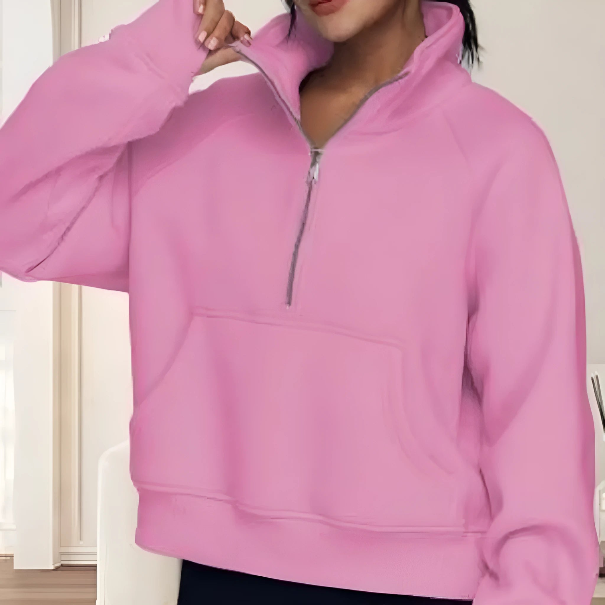 Women's loose lapel fleece-lined sweater in a solid colour showing raglan sleeve design
