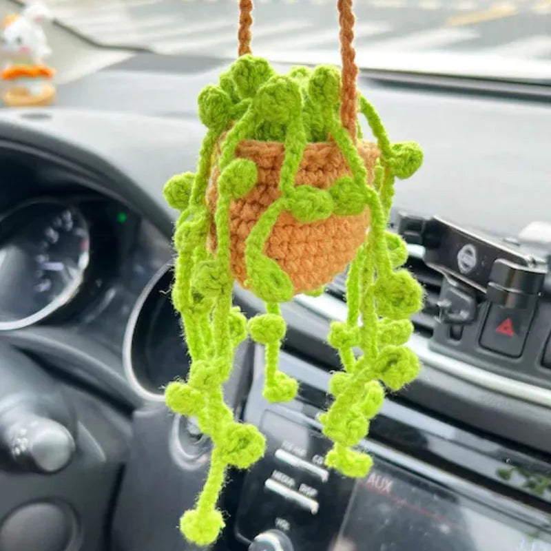Green and white knitted wool plant ornament for car dashboard with hanging cord