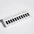 Black and white piano-shaped plastic temporary parking sign for vehicles