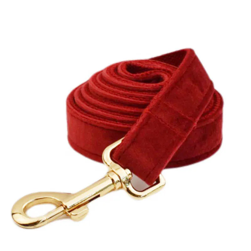 Cloth dog collar and leash set with matching vest, bow tie, and waste bag in multiple sizes