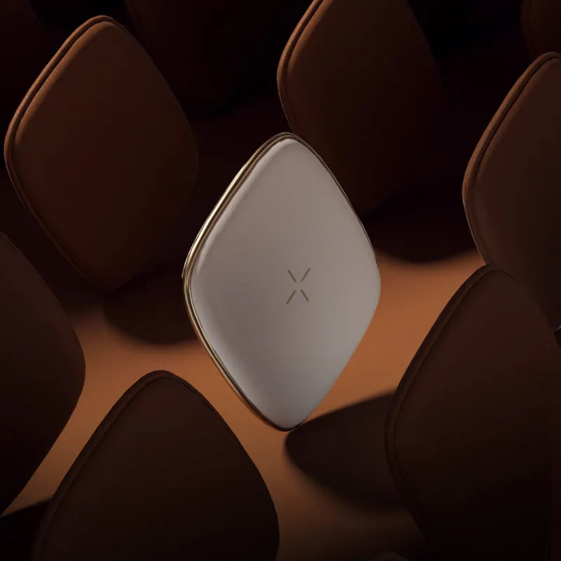 White wireless fast charger pad with USB interface on a desk