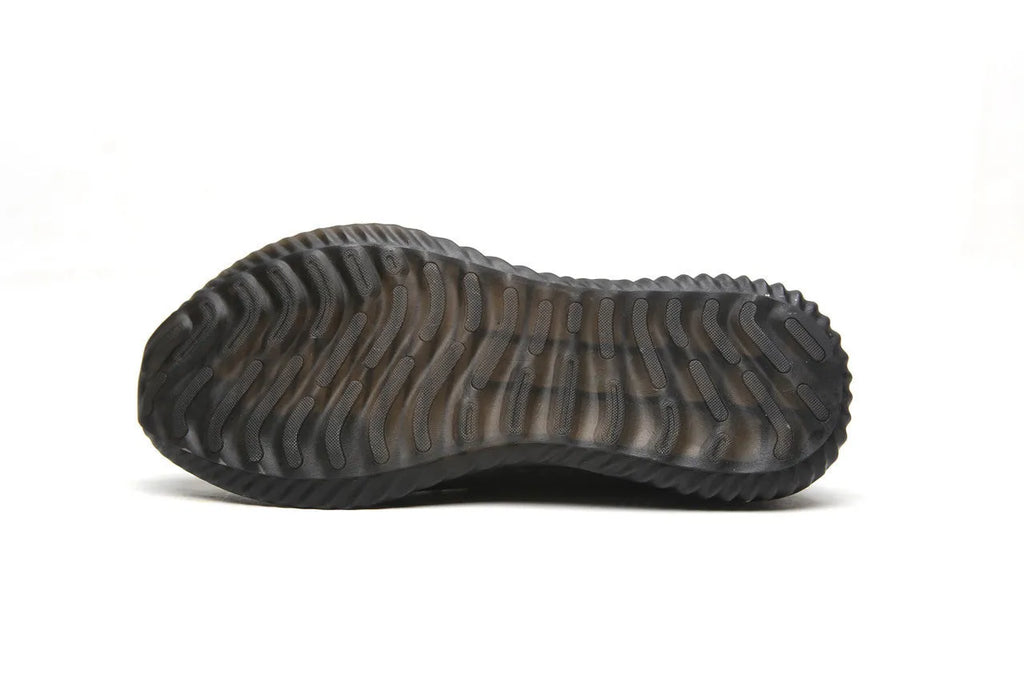 Men's black steel toe cap safety shoes with a low-cut design on a work surface.
