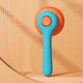 Blue and white self-cleaning pet grooming brush with a slicker comb head for cats and dogs.