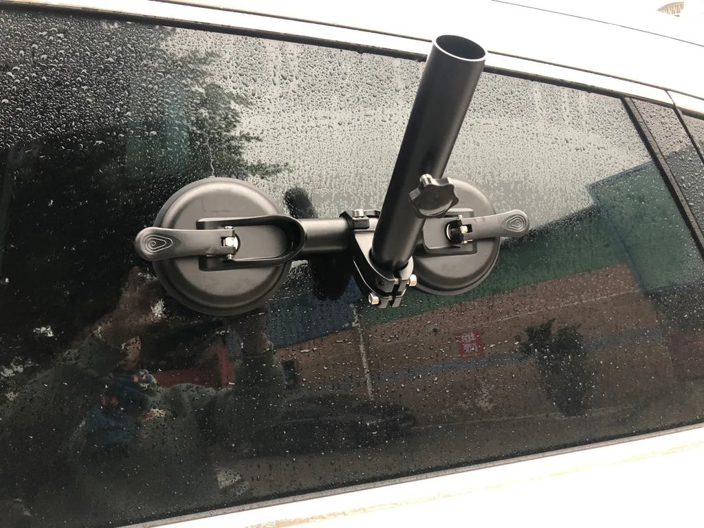 Black off-road car windscreen sucker mount with a large round rubber suction cup for flagpoles.