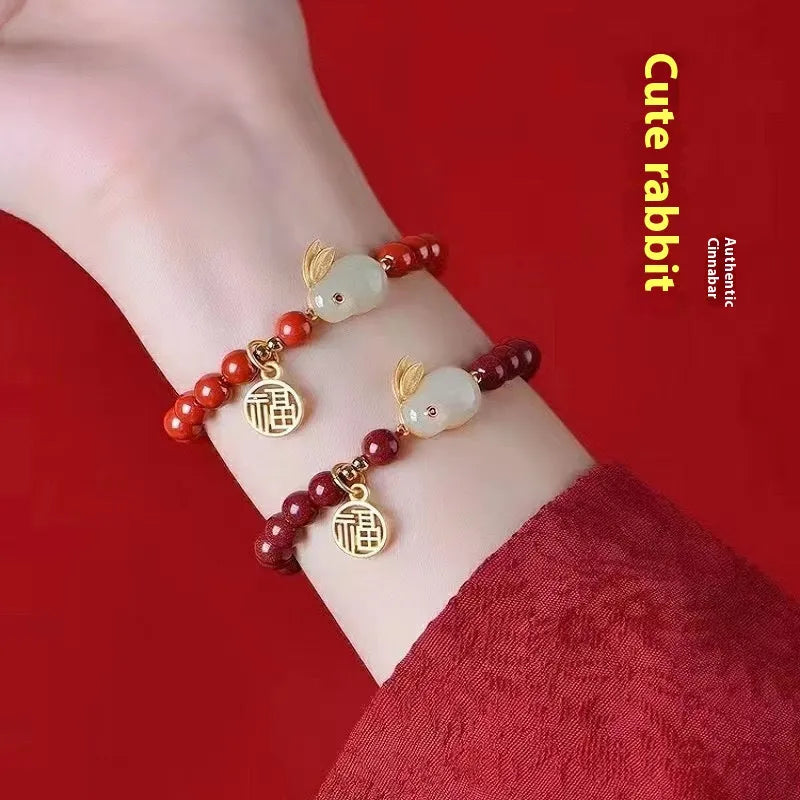 Purple gold sand cinnabar bracelet with a jade hare charm, shown with 6mm and 8mm bead size options.