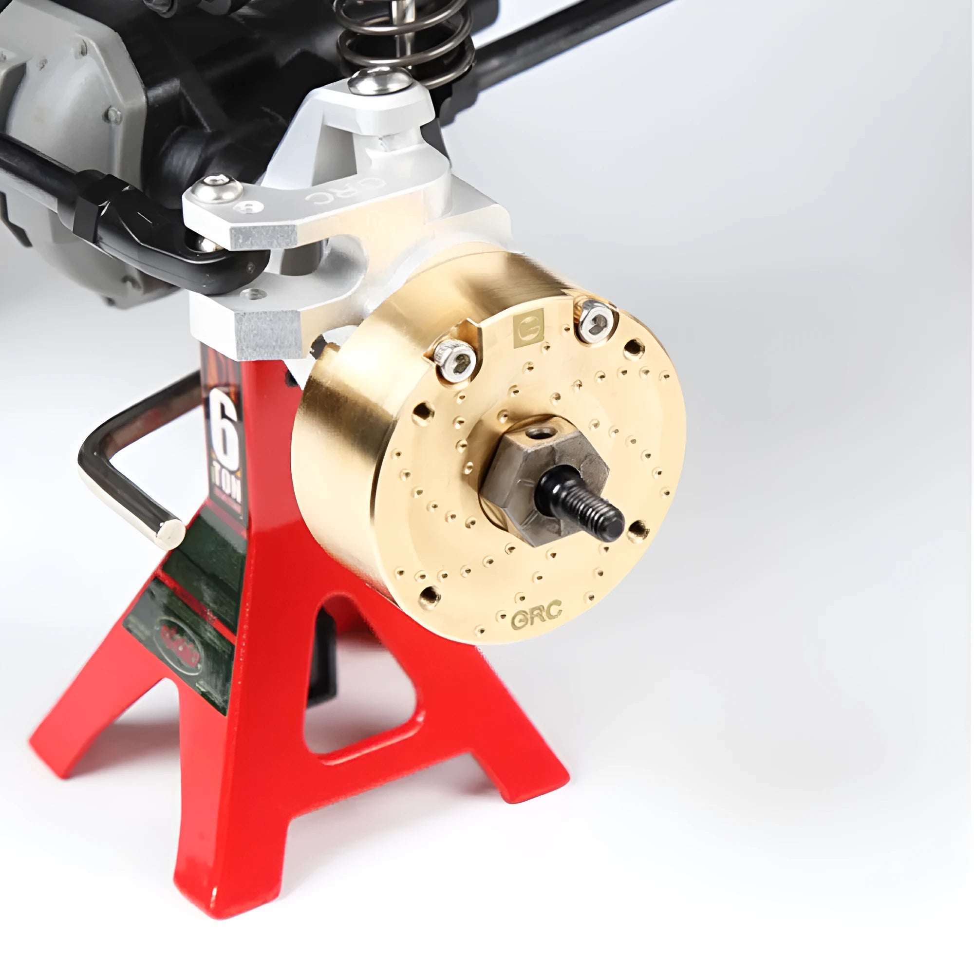 Brass gearbox cover component for toy axle door mechanisms