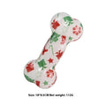 Printed bone-shaped dog toy with squeaker in seasonal Christmas red and Halloween pumpkin colours