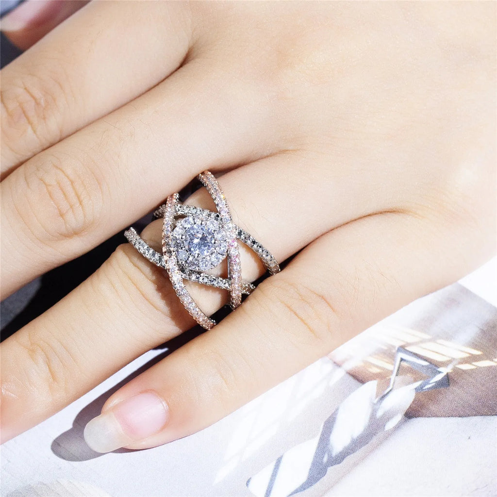 Women's geometric cross zircon engagement ring in copper with rose gold colour separation on display
