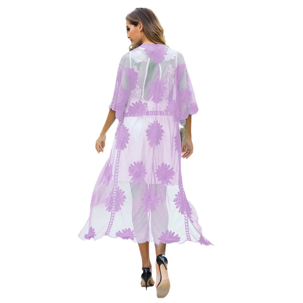 Light purple women's beach dress with lace embroidery, worn as a swimsuit cover-up.