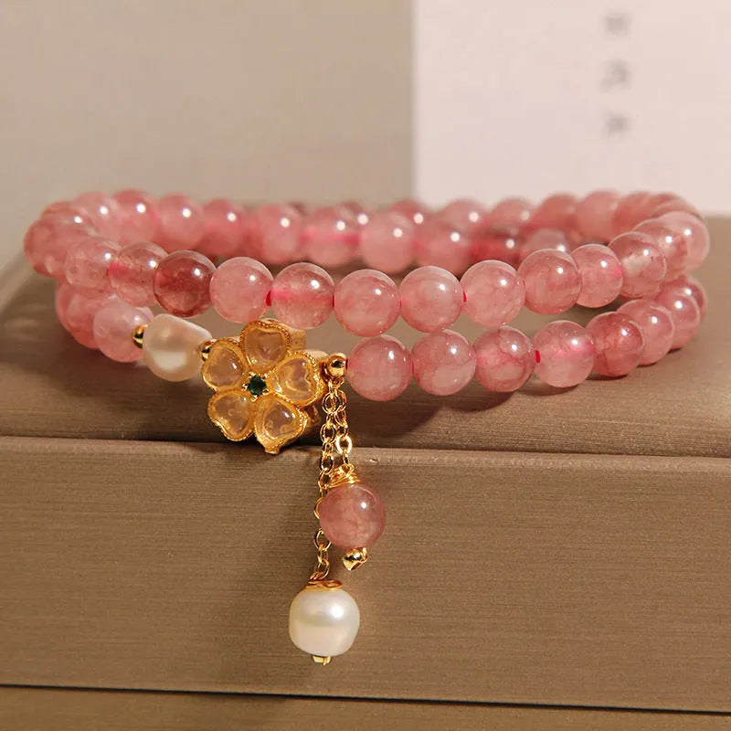 Women's twin ring bracelet with strawberry quartz four-leaf clover charms in Japanese Korean style