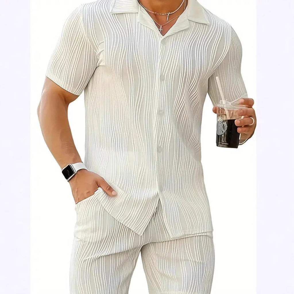 Men's black wave pattern short sleeve top and matching shorts casual set on a hanger.
