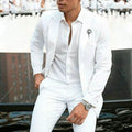 White men's slim fit two-piece suit on a hanger, suitable for weddings.