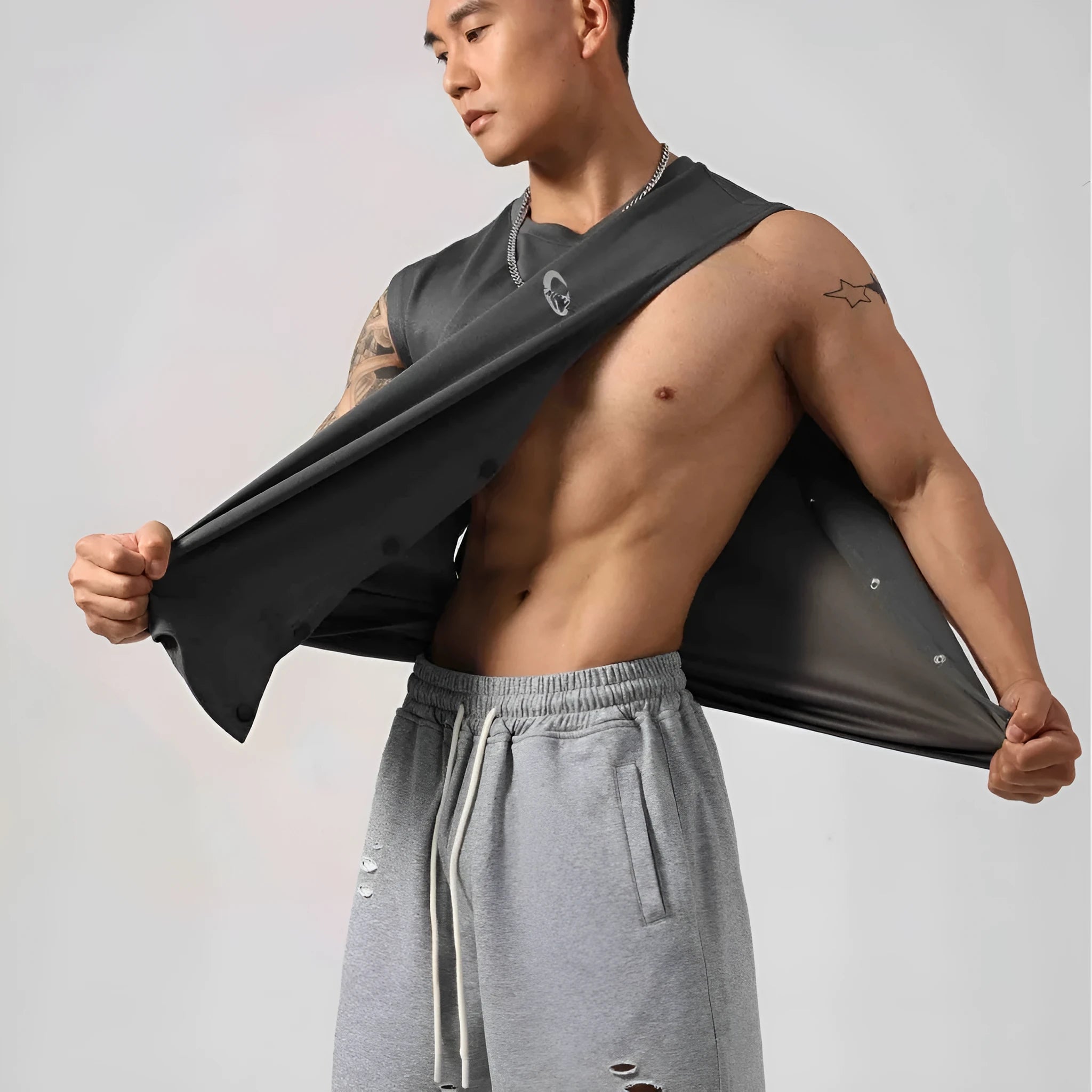 Men's loose black cotton fitness vest showing hidden hook side opening detail.