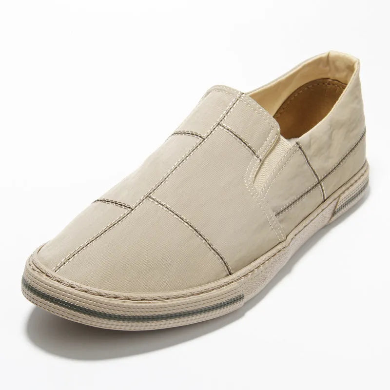 Men's low-top canvas slip-on shoes in khaki colour with a round toe and vulcanised rubber sole.