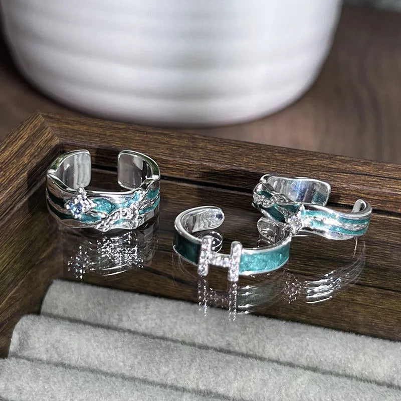 Mint green enamel asterism copper ring with folding irregular design and eight awn star elements