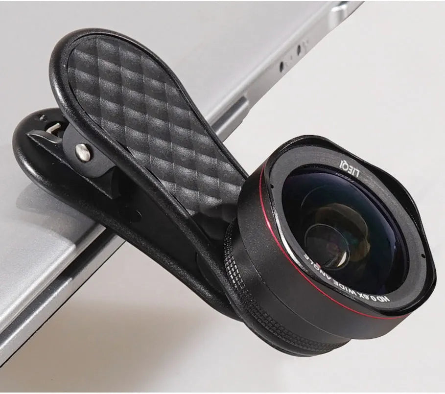 Black wide-angle and macro mobile phone lenses with clip and storage box on a table