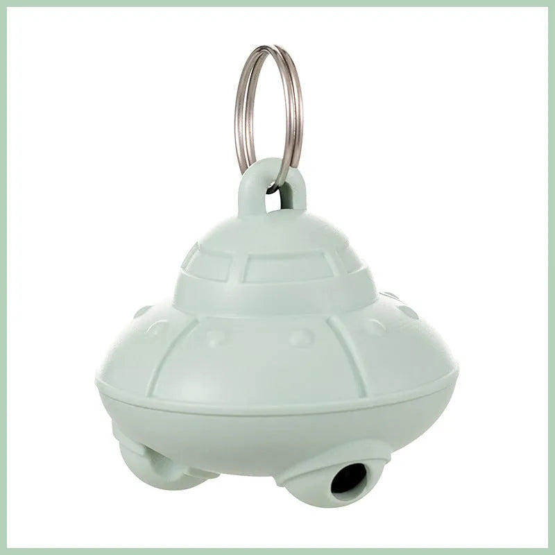 Green or pink cat collar laser toy with compact 3cm plastic housing showing USB charging port