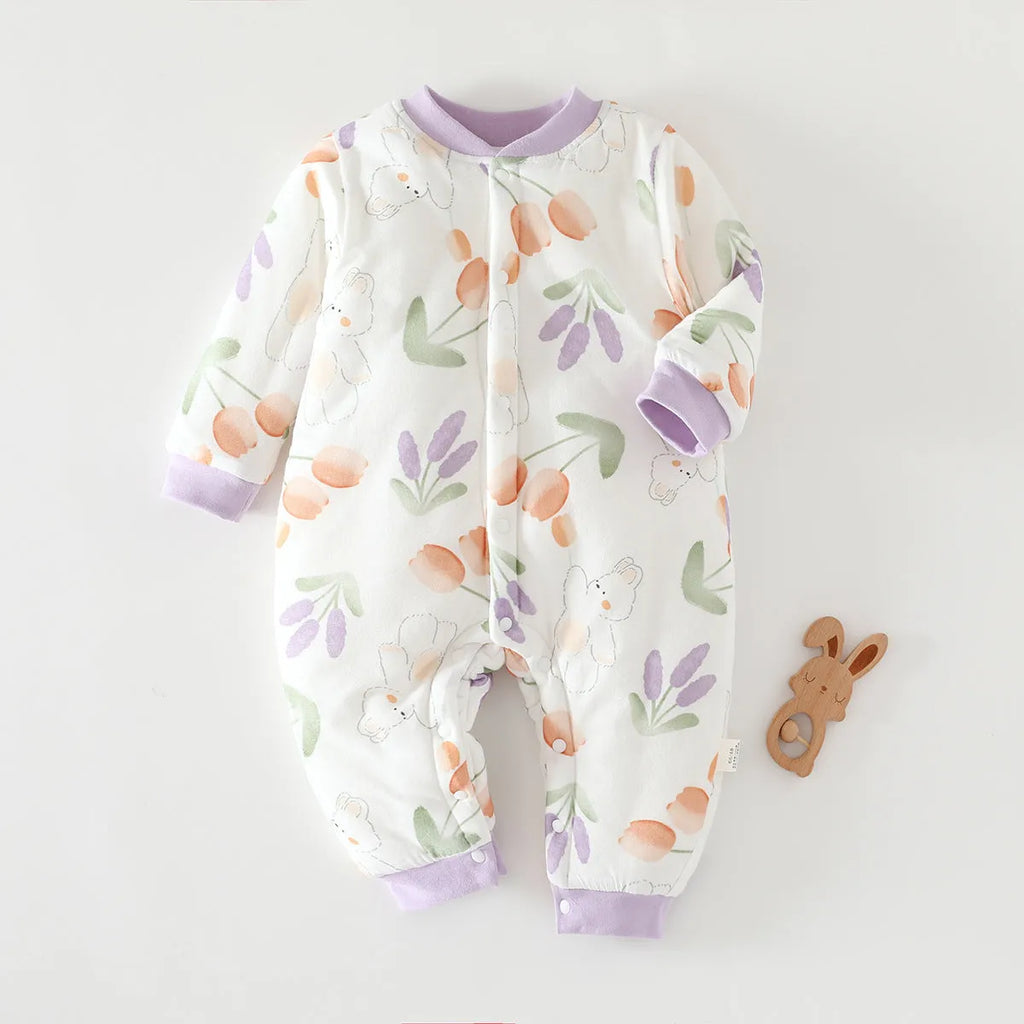 Infant one-piece romper in cotton with closed crotch, long sleeves, and animal-themed colours.