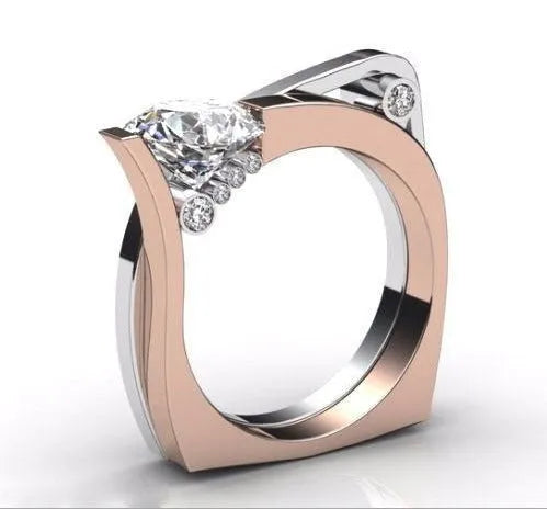 Rose gold geometric couple ring with inlaid zircon stones on a white background.