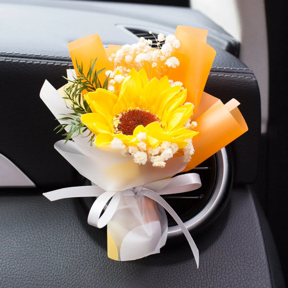 Dried flower car air freshener with natural aroma slices mounted on vehicle air conditioning vent