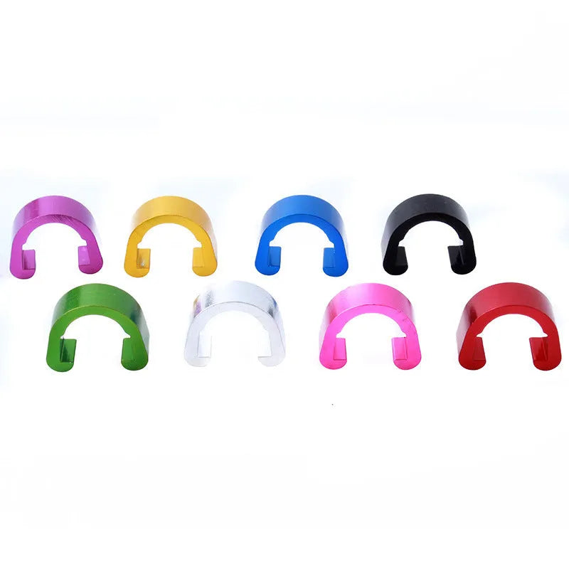 Set of ten small aluminium alloy C-shaped buckles in assorted colours on a white background.