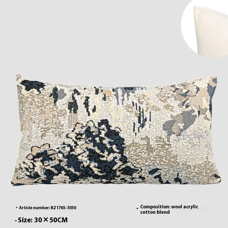 Antique blue floral patterned pillow on a sofa, shown in square and rectangular waist pillow sizes.