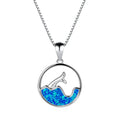 Geometric fishtail pendant necklace with a round blue opal on a silver-toned chain.