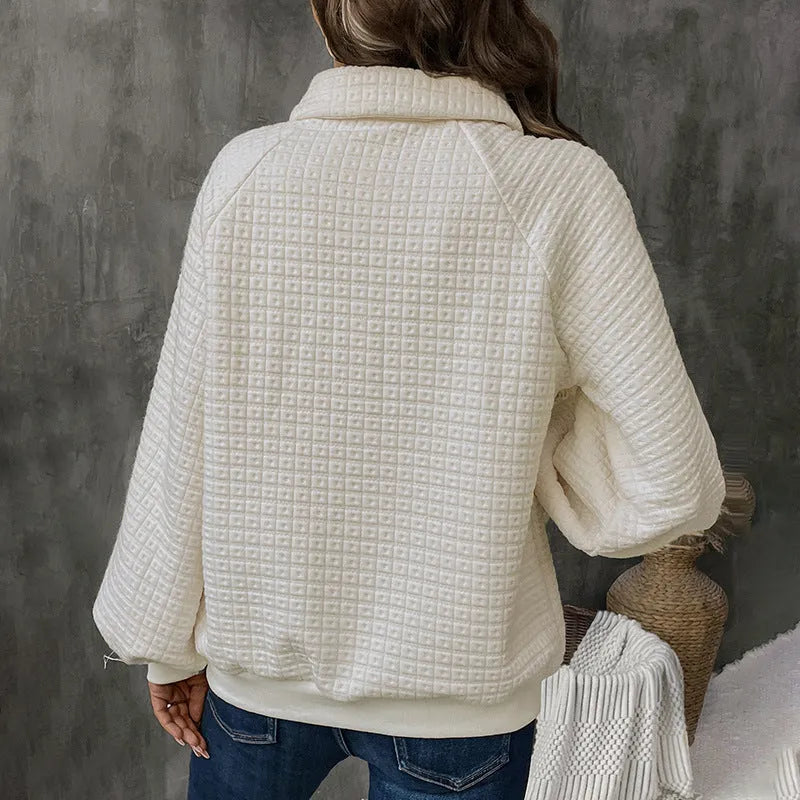 Women's milky white textured polo collar sweater on a hanger.