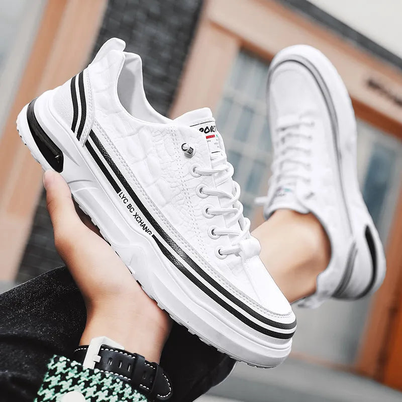 Youth low-top slip-on canvas sneakers in white black, side view