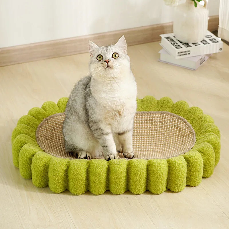 Green oval sisal cat scratch pad bowl serving as a cat bed and scratcher.