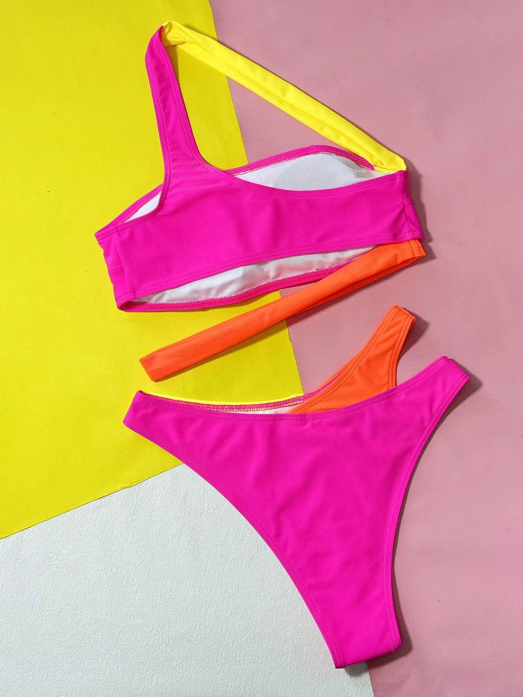 Rose red women's bikini with hollow contrast colour split design on a two-piece swimsuit set.