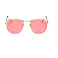 Retro street sunglasses with gold metal frame and transparent red resin lenses