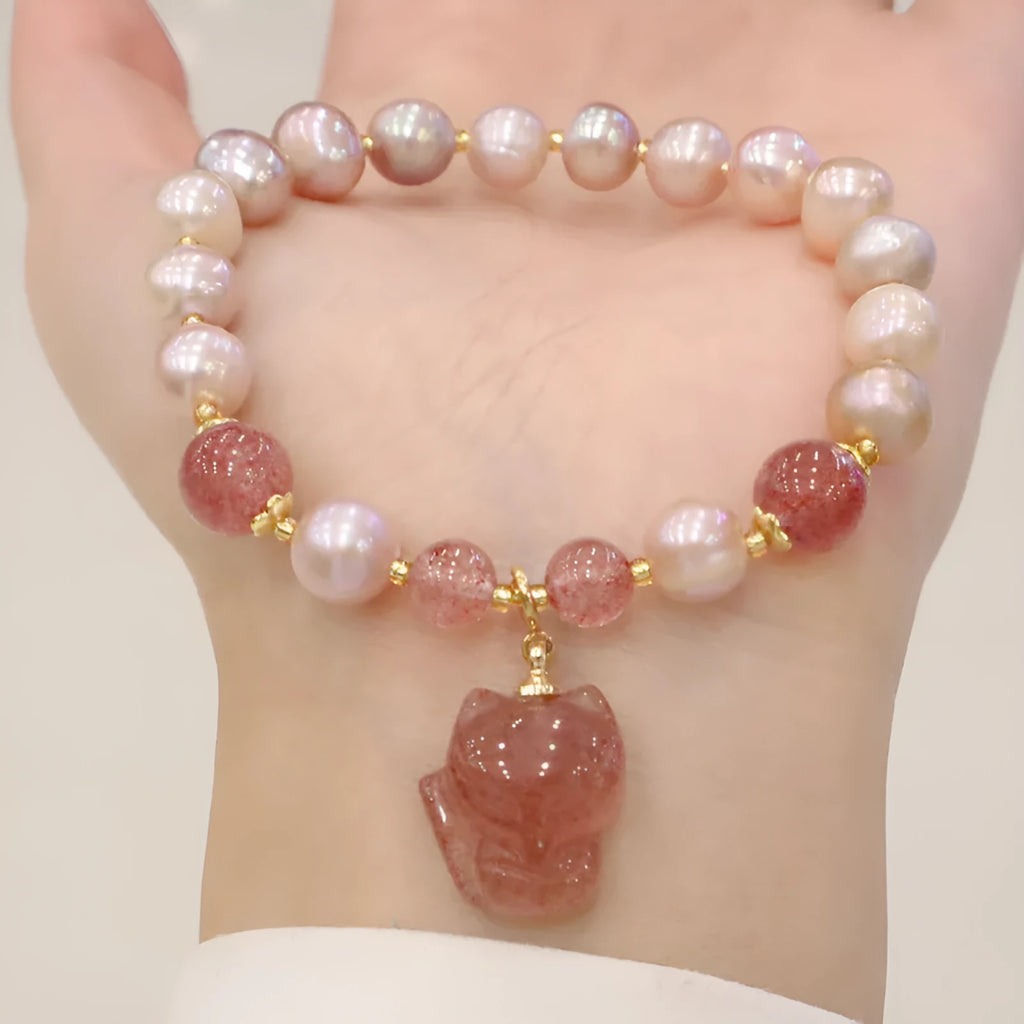 Women's light pink freshwater pearl bracelet with fox charm and strawberry quartz stones