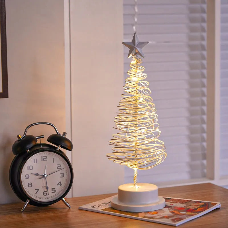 33cm tall metal LED Christmas tree ornament with warm white lights on tabletop