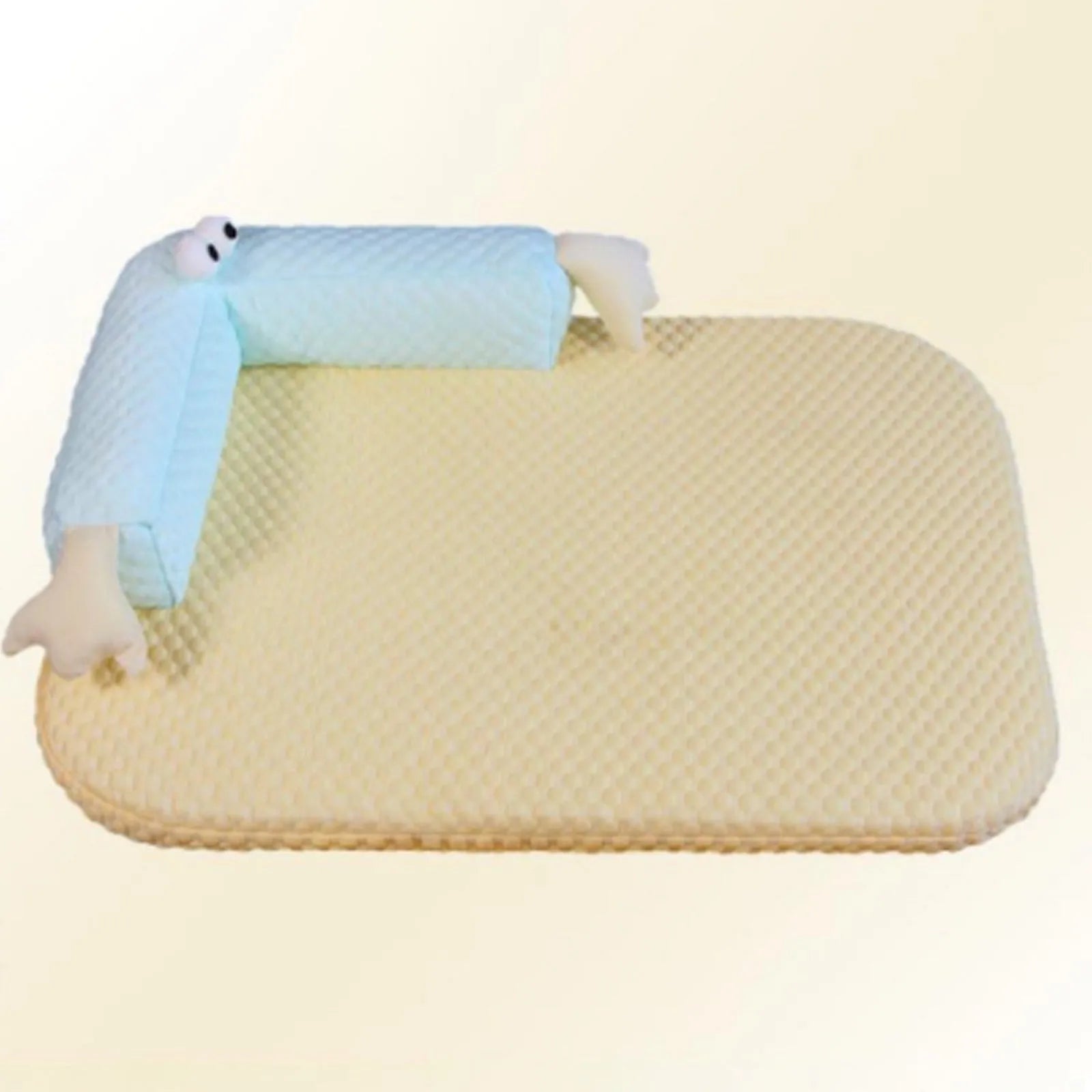 Blue pet cooling pad with big-eyed monster design, shown on a wooden floor.