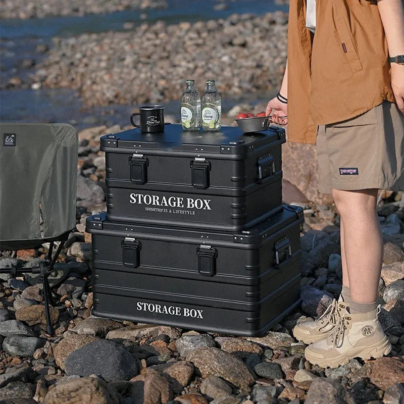 Army Green plastic storage box placed in a vehicle boot for organisation