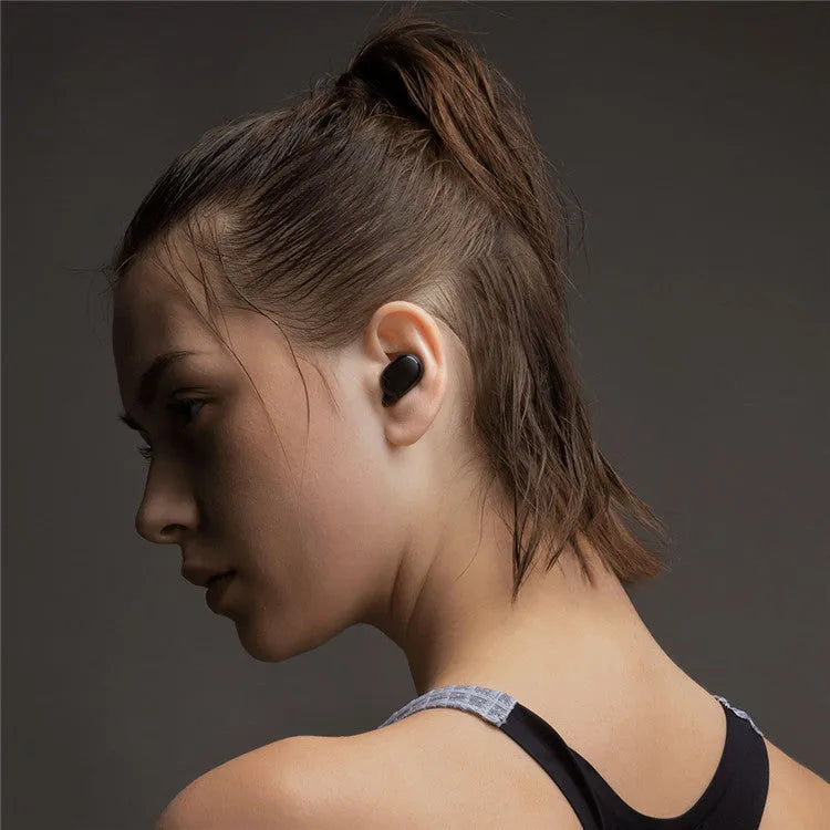 Redmi AirDots 2 black true wireless earbuds and charging case on a white background.