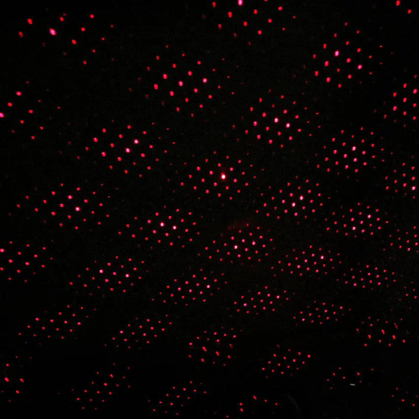 LED car roof star night lights projector showing purple star projection on car ceiling