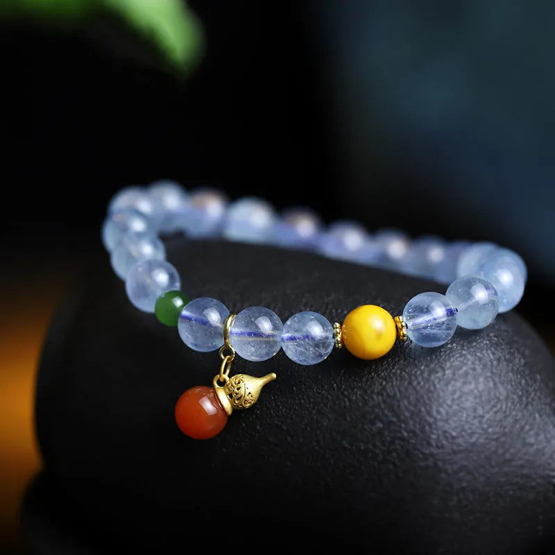 Women's aquamarine bracelet with 8mm geometric beads in iced aquamarine colour and ethnic retro style