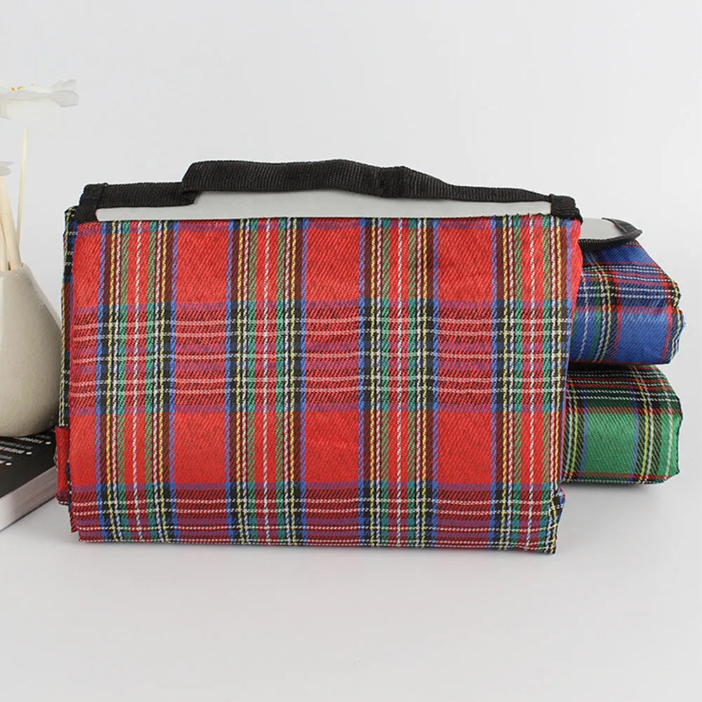 Waterproof acrylic picnic mat in green, red, or blue plaid, 150 x 100cm, with one cushion