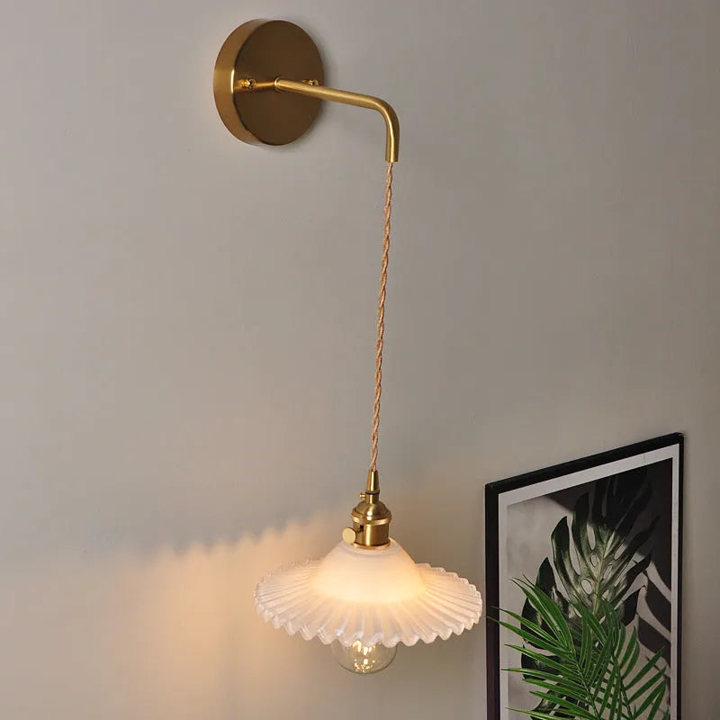 Retro brass lotus wall lamp with copper base and glass shade in one of six colours.